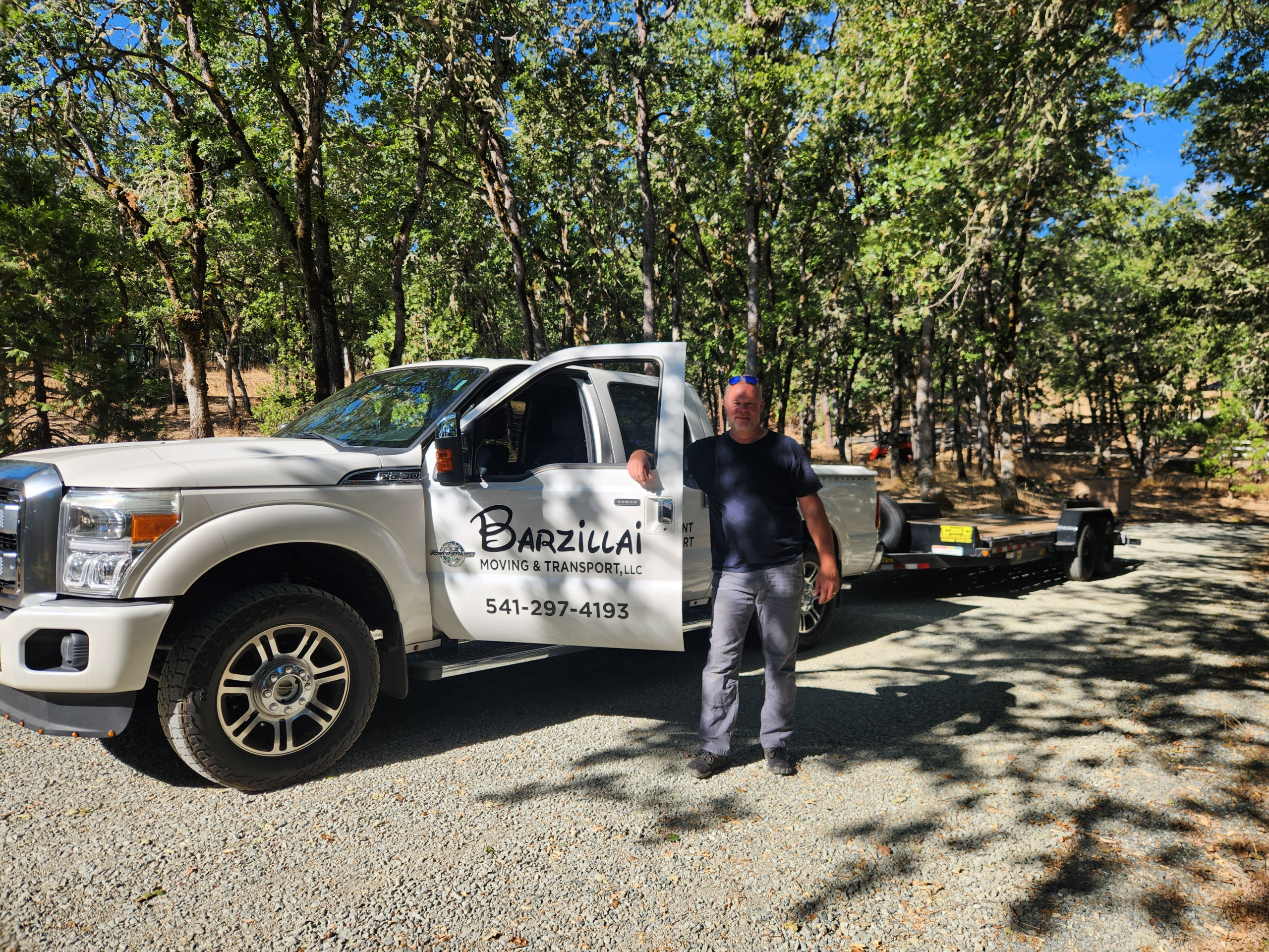 Barzillai truck and trailer ready for junk hauling and bulk item disposal services in Southern Oregon.